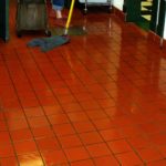 mopping a quarry tile kitchen floor